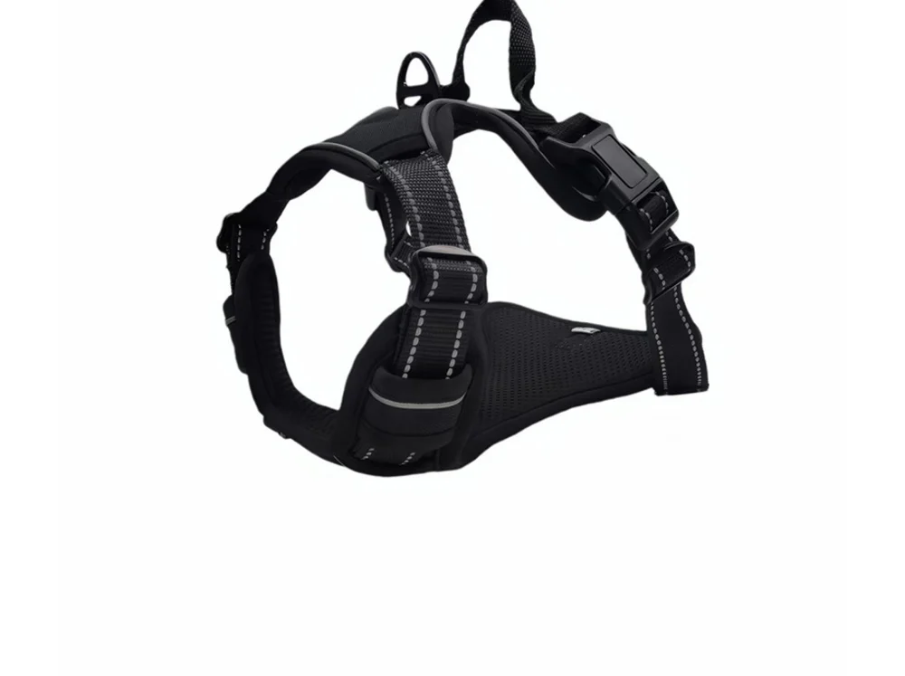 Black no-pull harness with a padded top handle, laid flat